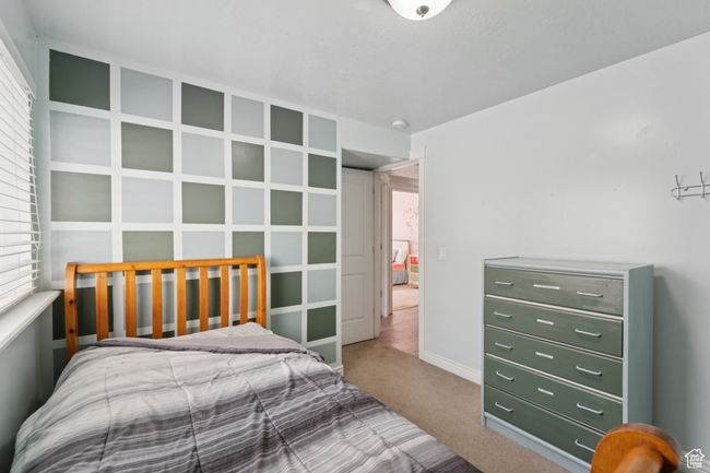 Bedroom with carpet floors and multiple windows | Image 27
