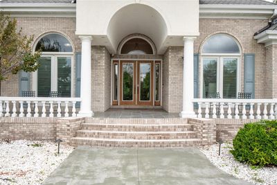 Doorway to property with a porch and french doors | Image 2