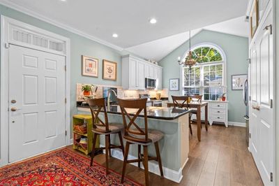 Light Filled Kitchen with Stainless Appliances, Tile Backsplash and Granite Countertops | Image 3