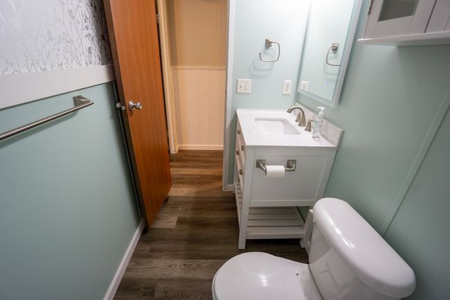 Bathroom featuring wood finished floors and vanity | Image 25