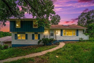 Tri-level home featuring a lawn | Image 2