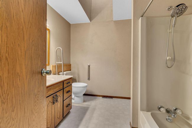 Main Floor Primary/Owner's Bedroom with walk-through Bathroom | Image 16