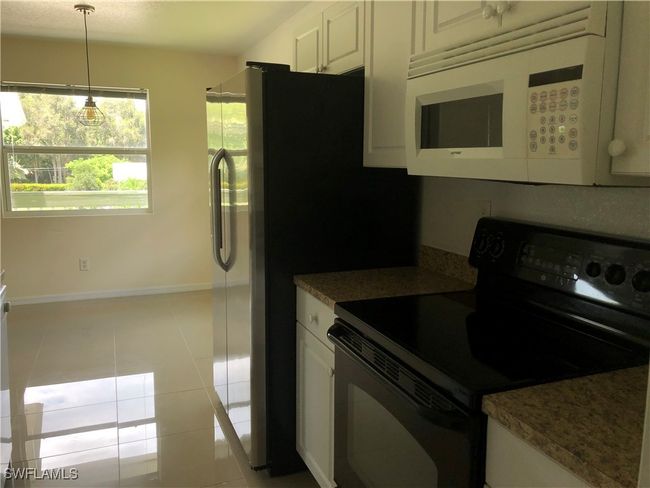 5615 Birdsong Ln, Home with 4 bedrooms, 2 bathrooms and null parking in BOKEELIA FL | Image 14