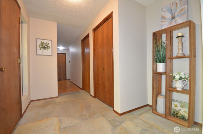 Entryway and Hallway Leading to the Bedrooms and Kitchen | Image 9