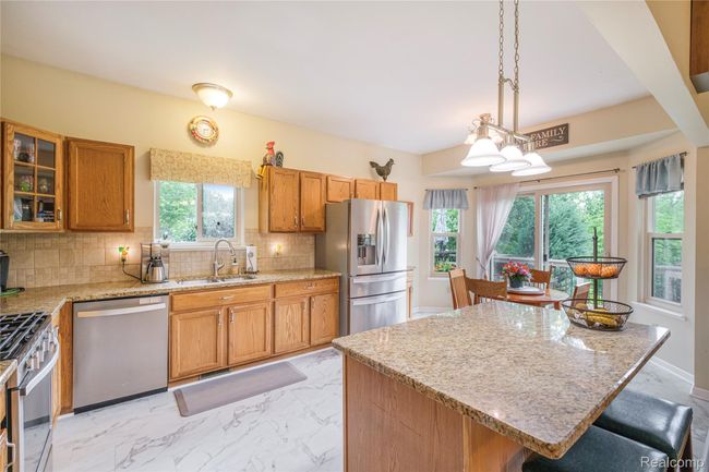 Kitchen opens to breakfast nook and deck | Image 8
