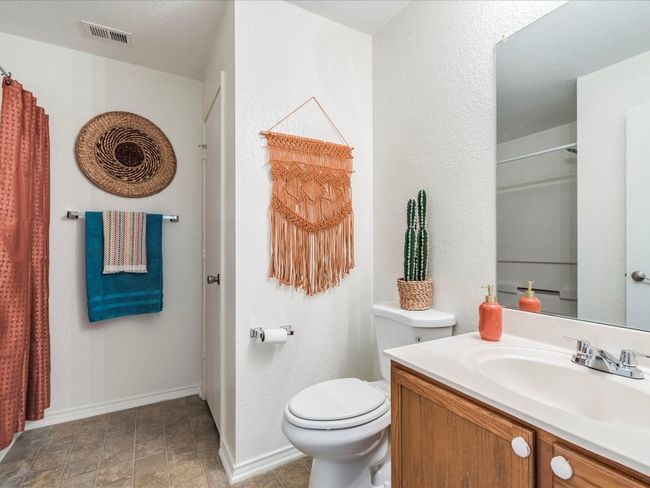 The full secondary bathroom is nice and roomy with a single vanity, linen closet and a shower/tub combo. | Image 23