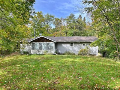 Backyard level grassy space and view to home with 3-season porch.jpg | Image 2