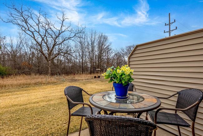 Enjoy added seclusion with a privacy wall that creates a cozy and comfortable outdoor space. | Image 20