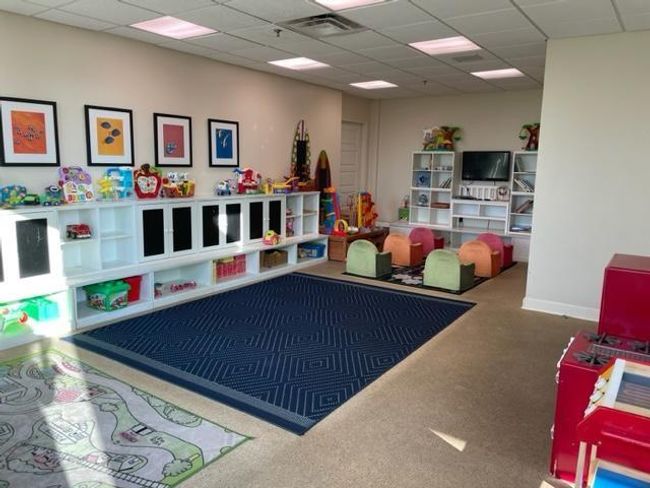 Perfect indoor playroom for endless creativity, paired with an outdoor pool and nearby beach for family fun. | Image 26