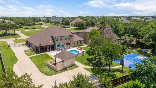 Aerial view of property and surrounding area with a pool | Image 38