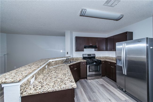 granite counters, stainless appliances, side x side refrigerator included | Image 7