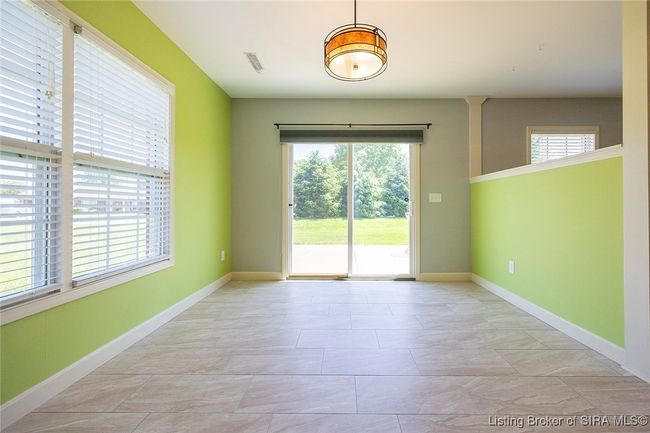 Dining area adjoining kitchen and access to patio | Image 57