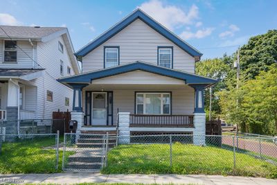 View of front of property with a front lawn and a porch | Image 1