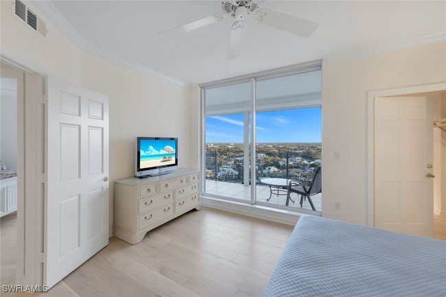Guest Bedroom Suite with Lanai access for Sunrise, Venetian Bay, and City Views | Image 19