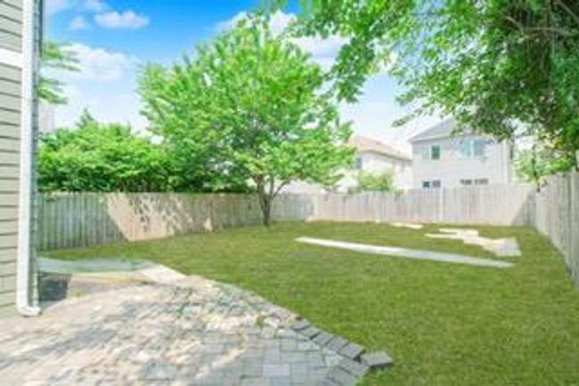 Fenced backyard featuring a patio | Image 16