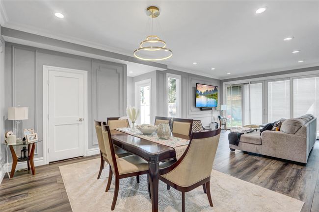 Dining space with wood finished floors, recessed lighting, and crown molding | Image 5