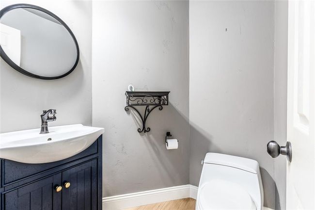 A half-bathroom is conveniently located downstairs near the living room. | Image 10