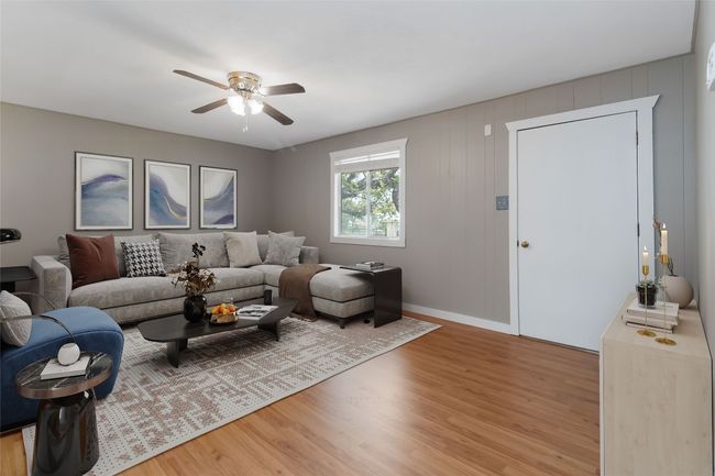 Living area with light wood-type flooring and a ceiling fan | Image 30