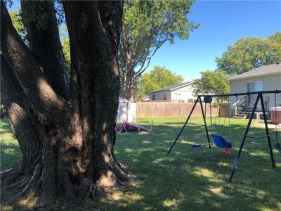 View of yard with a playground | Image 2