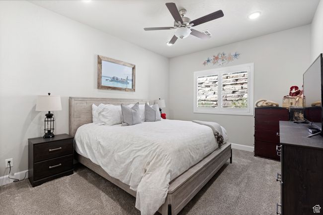 Bedroom featuring light carpet, recessed lighting, and ceiling fan | Image 24