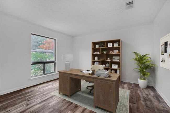 Office space featuring wood finished floors and baseboards ~ virtually staged | Image 13