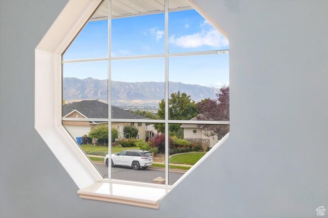 Interior space featuring a mountain view | Image 8