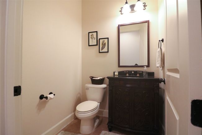 Bathroom with tile patterned floors, vanity, baseboards, and toilet | Image 14