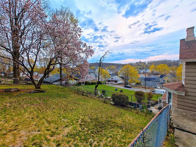 View of yard with a residential view and fence | Image 8