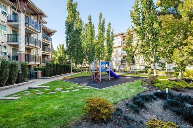 Community playground with a yard | Image 26