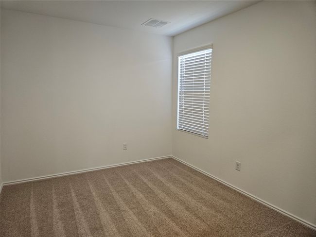 Carpeted empty room with visible vents | Image 12
