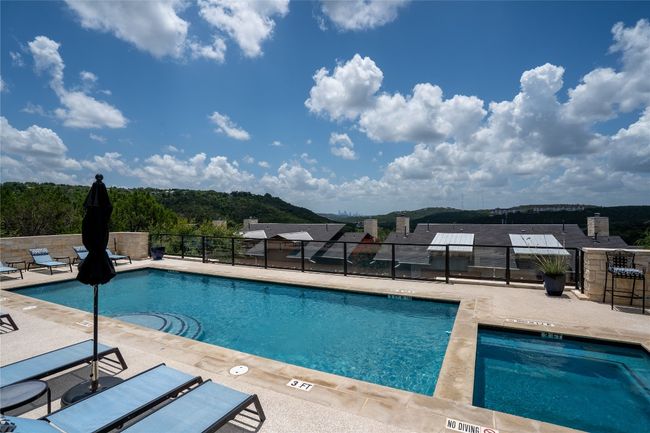 Community pool with a patio | Image 37