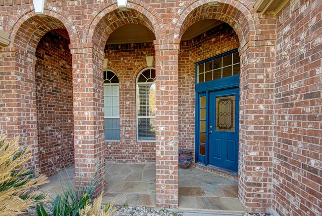 View of exterior entry featuring brick siding | Image 4