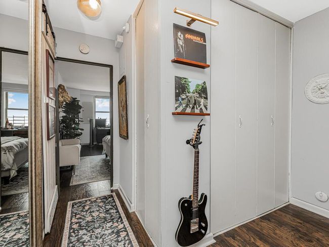 Hallway with dark wood-style flooring | Image 6