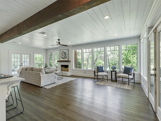 Living area with recessed lighting, dark wood finished floors, a healthy amount of sunlight, and ceiling fan | Image 16