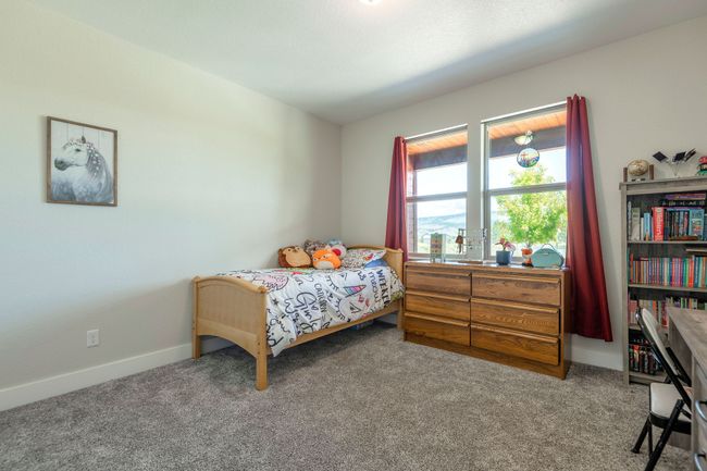 Carpeted bedroom with baseboards | Image 23