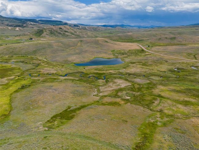 Birds eye view of property featuring a water and mountain view and a rural view | Image 34