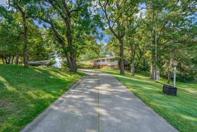 Low maintenance concrete driveway with potential for an additional entrance on State Street, from the back lot. | Image 3