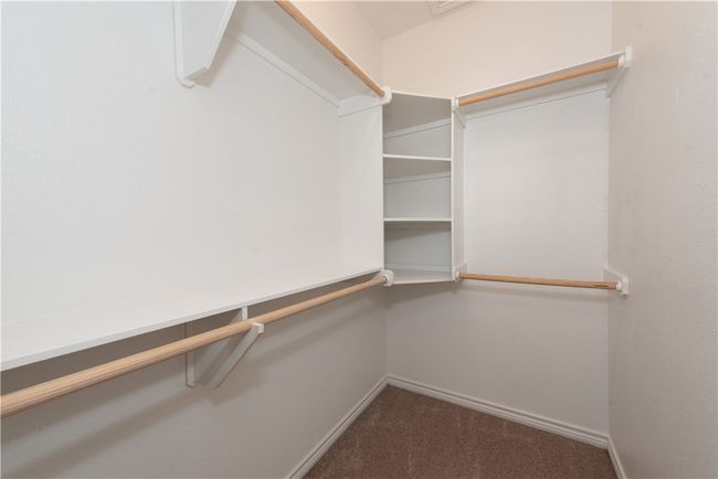 Spacious closet featuring carpet floors | Image 10