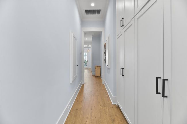 Lower-level hallway offers ample storage. | Image 31