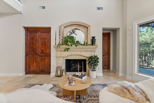 Living room with fireplace view. | Image 9