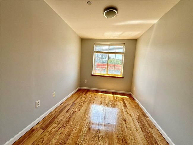 Spare room with light wood finished floors and baseboards | Image 7