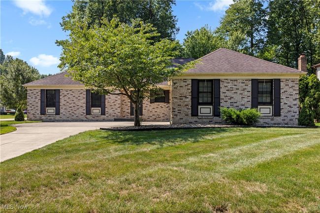 Ranch-style house featuring brick front, and front yard | Image 40