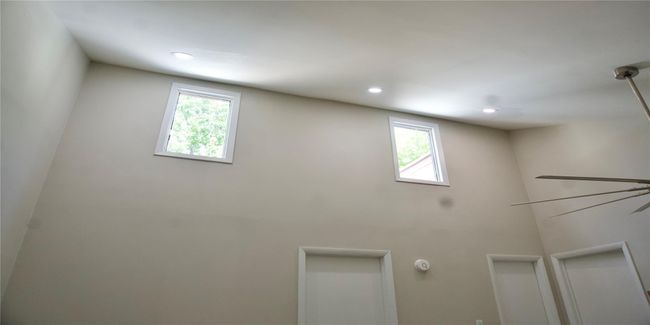 Laundry area featuring a healthy amount of sunlight and recessed lighting | Image 39