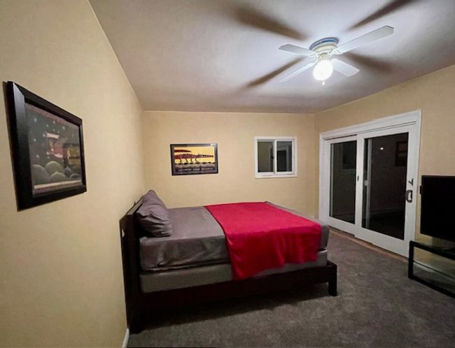 Bedroom 2 with ceiling fan and dark carpet | Image 20