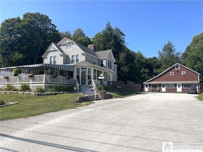 House and barn with 3 lower units and 1 upper efficiency. | Image 2