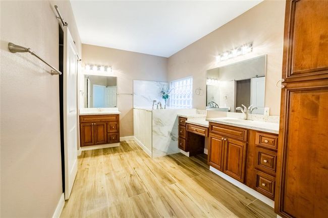 Primary bathroom! Seller is giving concessions to put a new shower in where the old shower was. Plumbing still in the wall. | Image 24