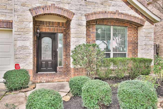 Front yard features Texas landscaping that is easy to maintain. | Image 4