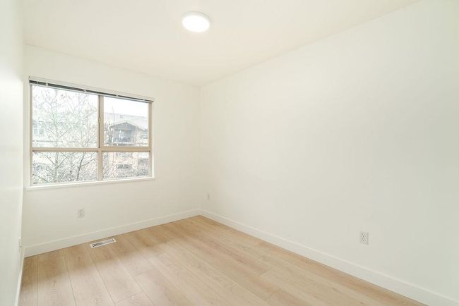 Unfurnished room featuring baseboards, light wood-style floors, and visible vents | Image 33