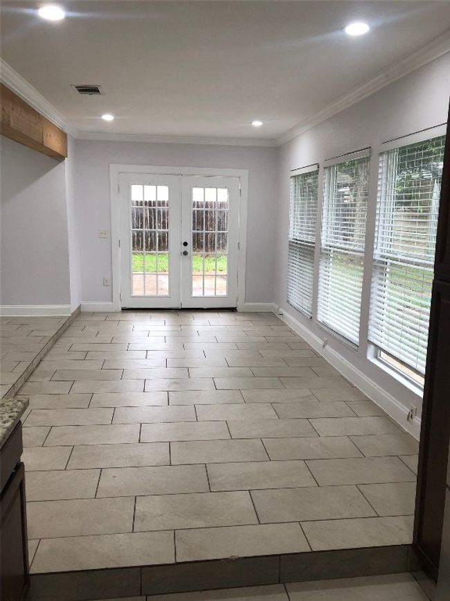 Spare room featuring french doors, crown molding, and recessed lighting | Image 6