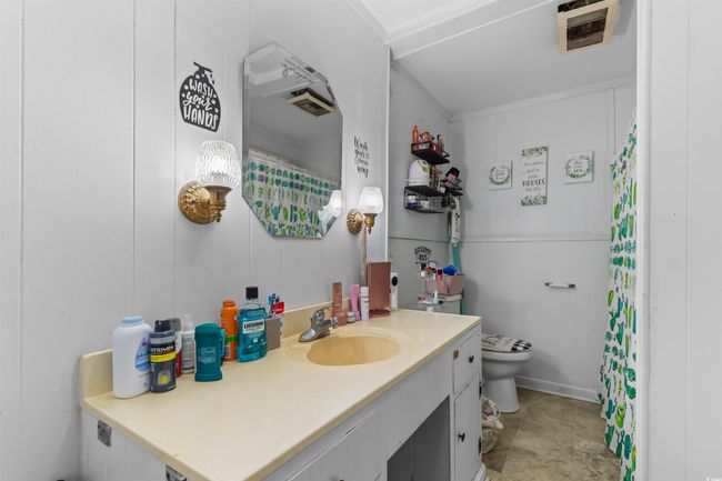 Bathroom with vanity and a shower with curtain | Image 27